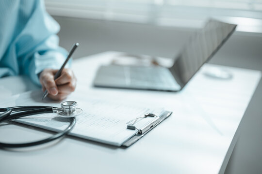 This focused image brings together medical insurance paperwork, healthcare costs, and stethoscope. The setting supports organized records, careful decisions, responsible spending, and clear planning.