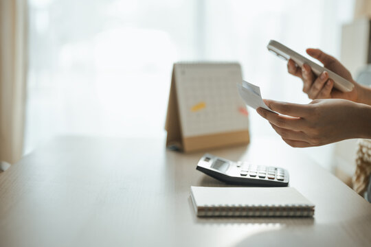 mobile expense tracking, receipt, and smartphone shape this practical household finance scene. It conveys practical choices, organized planning, everyday money management, and financial awareness.