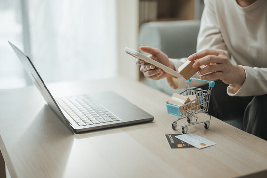 mobile shopping, online checkout, and smartphone shape this practical household finance scene. It conveys practical choices, organized planning, everyday money management, and financial awareness.