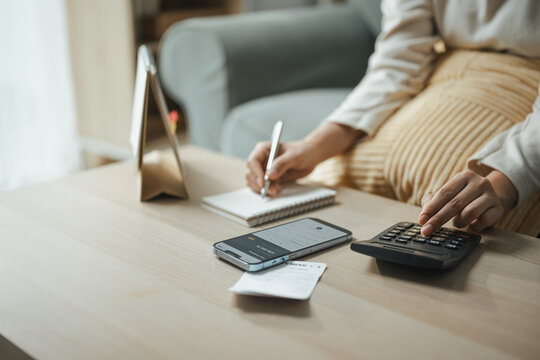 monthly budget, calculator, and expense log shape this practical household finance scene. It conveys practical choices, organized planning, everyday money management, and financial awareness.