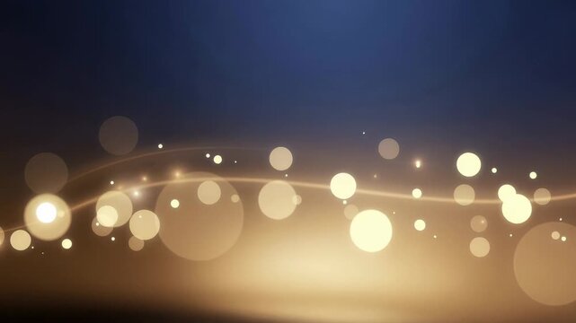 Abstract glowing light bokeh background with soft golden and blue tones for festive and elegant design