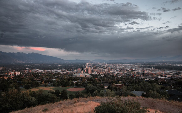 Post Storm Sunset View of Salt Lake City Skyline and Utah State Capitol from Ensign Peak with Wasatch Mountains in Summer