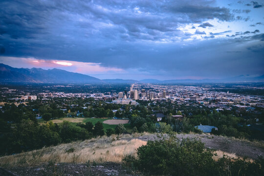 Post Storm Sunset View of Salt Lake City Skyline and Utah State Capitol from Ensign Peak with Wasatch Mountains in Summer
