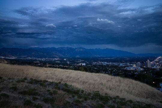 Post Storm Sunset View of Salt Lake City Skyline and Utah State Capitol from Ensign Peak with Wasatch Mountains in Summer