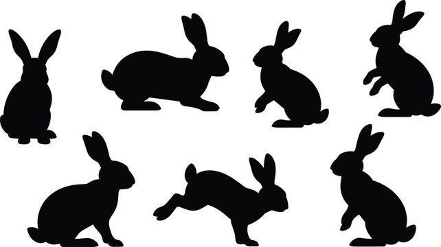 Group of black silhouette rabbits in different poses and actions, including sitting, running, and standing