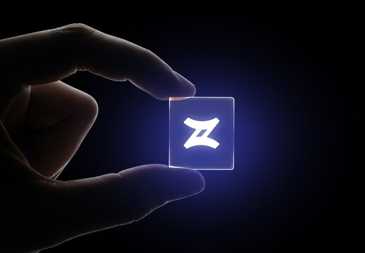 Close-up Transparent Glass Card or Logo Mockup Held Between Fingers
