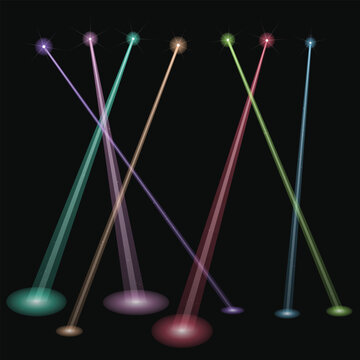 Abstract colorful light beams pointing up in the dark night sky for a festive atmosphere