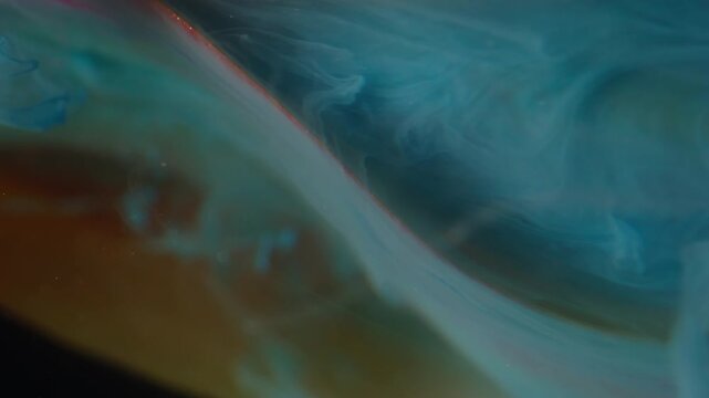 Vertical video. Fog flower. Ethereal smoke. Defocused yellow red color tulip plant nature blue ink flowing in water on abstract background.