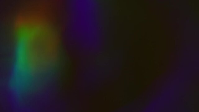 Blur rainbow glare. Glow gleam. Defocused blue red multicolor shine light lens flare flicker circle beam blaze on dark black abstract art background.