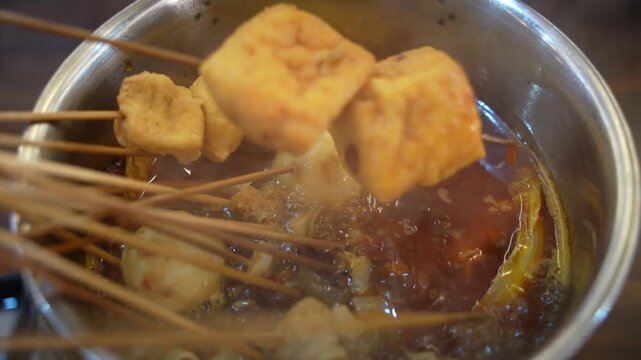 Chuan Chuan Xiang is a traditional snack in Sichuan, China. Its characteristic feature is to skewer various ingredients on bamboo sticks and then cook them in a boiling pot.