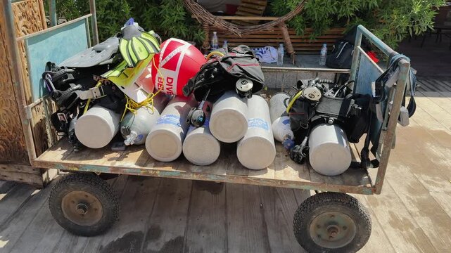 Diving gear and cylinders loaded on cart for Red Sea excursion