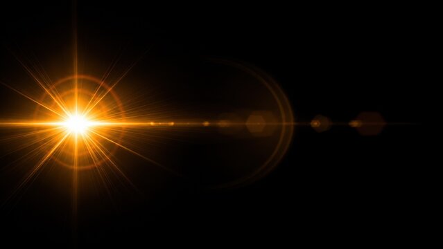 Abstract golden sun flare light effect with glowing rays isolated on a black background for digital design projects