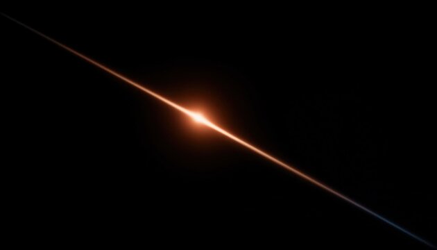 A bright diagonal lens flare light effect featuring a glowing orange starburst isolated on a deep black background