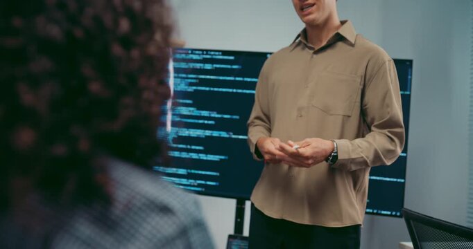 Diverse team software developer present coding on screen to colleague at office. Mentor coaching program leader, Creative startup teamwork discussion, Artificial intelligence system workshop concept.