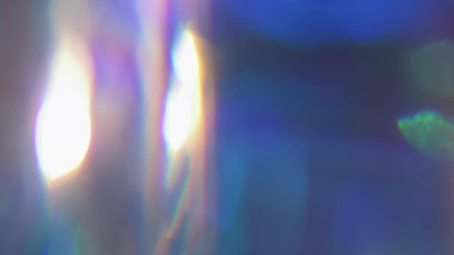 Prism blur light. Leak lens. Neon color crystal reflection spin texture. Purple blue violet ray fluorescent glow abstract background.