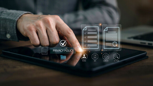 Man touching tablet displaying privacy policy and terms of service compliance digital interface