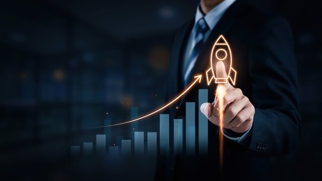Professional's hand touching a glowing rocket icon ascending from a digital graph, representing business growth and startup acceleration on a dark background.