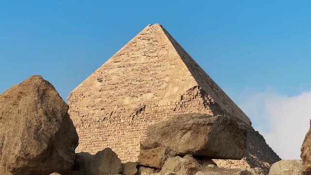 Slider Motion Shot of Pyramid of Khafre Seen Through Ancient Ruins with Cloud Shadow at Giza Necropolis