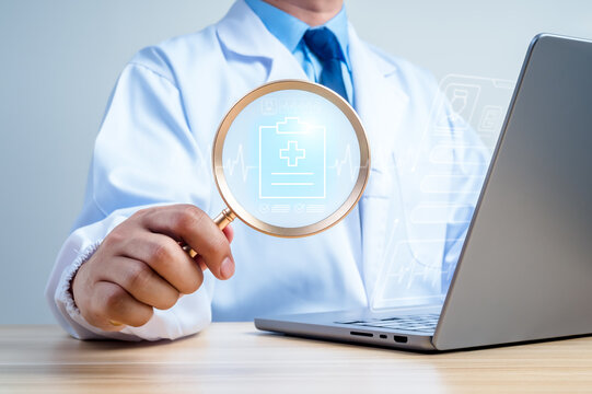 Doctor hold magnifier reviewing electronic health record on laptop with digital medical interface. Patient records, clinical documentation, digital medical data analysis, modern healthcare technology.