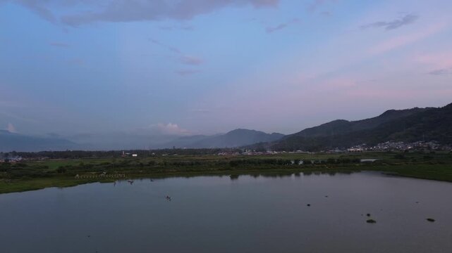 Scenic Landscape of Lake and Mountains at Sunset