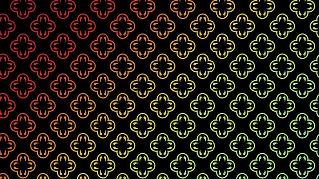 Seamless looping animation of a repeating clover pattern with a gradient color transition from red to green on a black background, motion graphics.