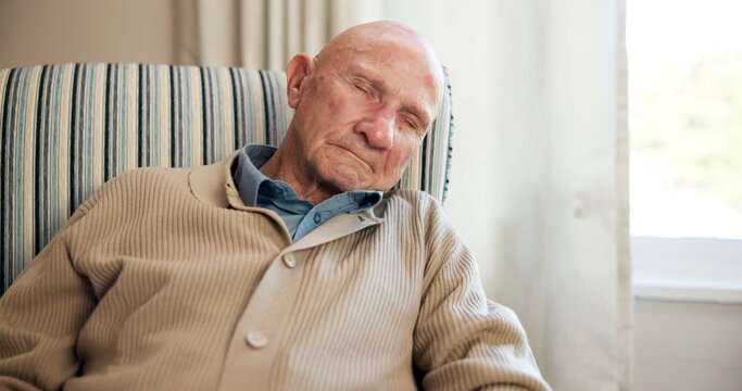 Relax, sleeping and old man in lounge with chill, comfortable rest and unwind on weekend break. Fatigue, cozy and elderly person in home with nap, peaceful dreaming and calm moment in retirement.