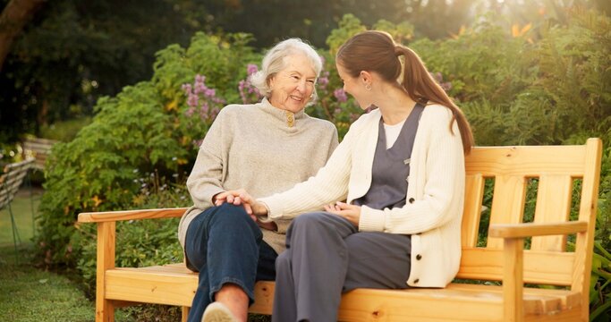 Caregiver, bench and senior woman in garden with smile, conversation or elderly care at nursing home. Happy, nurse and old person in backyard for retirement, friendly chat or support for homecare