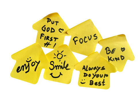 Group of yellow sticky notes with positive handwritten messages and inspirational quotes