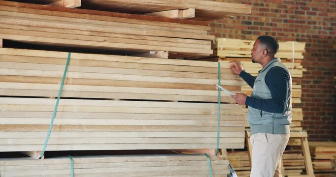 Carpenter, workshop and man on tablet for inspection, quality assurance and material inventory. Factory, carpentry and African person on tech for woodworking, timber production and evaluation report