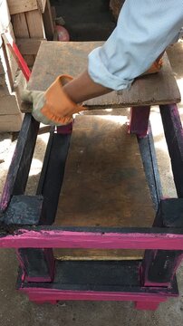 Fitting Recycled Wood Board onto Metal Base Frame to Build Table