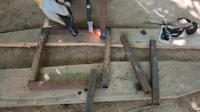 welding a support bracket to a base
