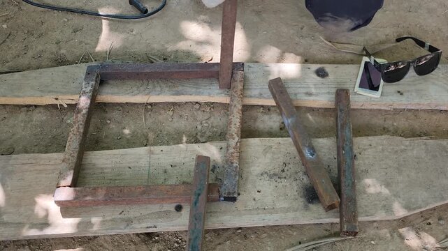 Measuring Steel Pipe with Tape Measure for Frame Leg Construction