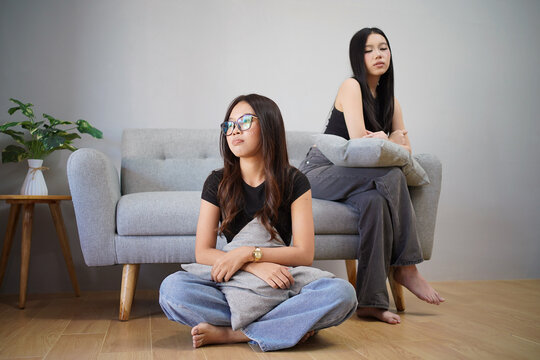 Upset Indonesian Friends Sitting Apart After Relationship Conflict