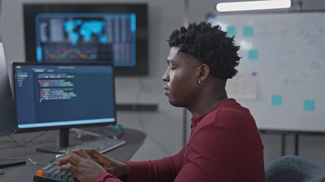 Male developer configures development environment settings and system setup, demonstrating technical configuration and workspace optimization workflow.