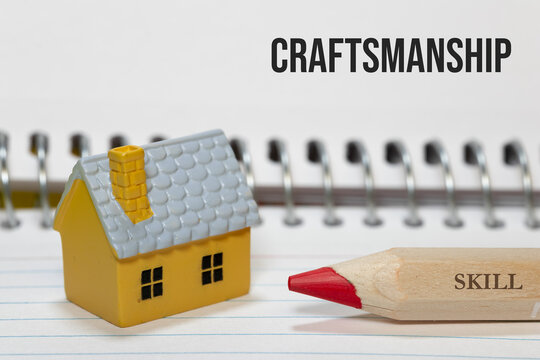 Miniature house representing craftsmanship and skill in real estate