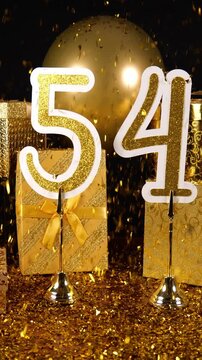 Gold Number 54 with Gold Glitter Confetti Sparkles with Gifts and Balloons for Party Fifty Four Vertical