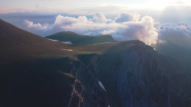 Aerial View of Mount Olympus Ridge with Christos Kakalos Refuge and Rolling Clouds