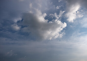 Obraz premium Dark and Moody Thunderstorm Clouds Forming in the Sky Before Heavy Rainfall and Severe Weather, Dark sky with stormy clouds,Dark clouds before a thunder-storm,clouds before rain 