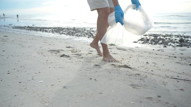 Save ocean. Volunteer pick up trash garbage at the beach and plastic bottles are difficult decompose prevent harm aquatic life. Earth, Environment, Greening planet, reduce global warming, Save world