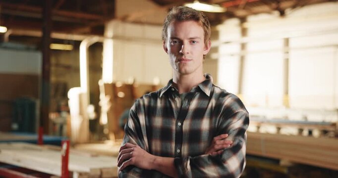Carpentry, crossed arms and face of man in workshop for woodworking, furniture and timber business. Carpenter, portrait and person with confidence for manufacturing, lumber production and service