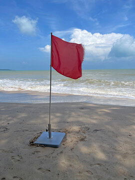 Red flags on the beach warn tourists not to swim in the sea.