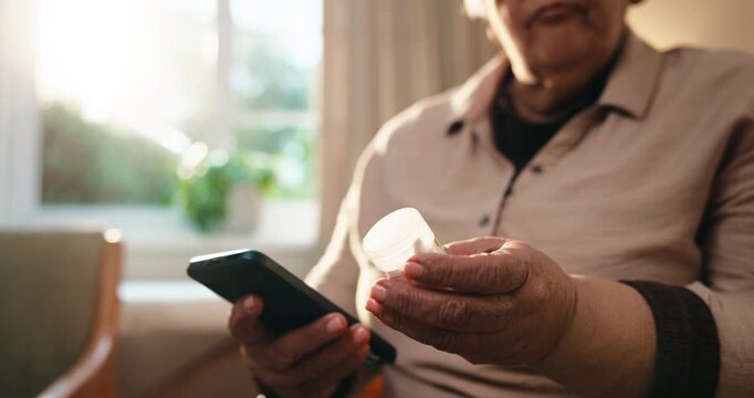 Hands, medicine and old woman with phone in home, prescription pills or checking side effects on web. Wellness, treatment and senior person with drugs, online and searching for dosage tips on mobile