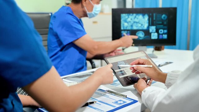 Asian medical team discusses virus research, vaccine development and infectious disease strategy using digital healthcare data during a clinical meeting.