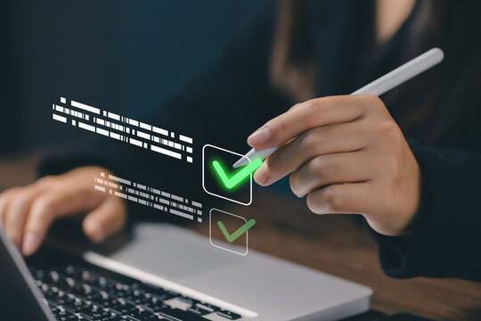 Business professional approving digital documents with electronic verification and online compliance using a laptop and stylus, representing secure workflow, productivity, authentication.