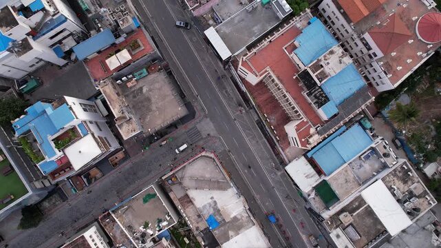 An aerial view of busy urban streets and densely packed city buildings