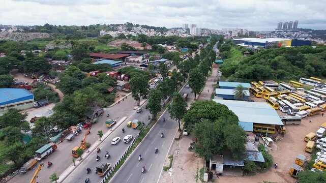 Aerial panoramic view showing busy regular traffic on lush bangalore mysore highway during winter