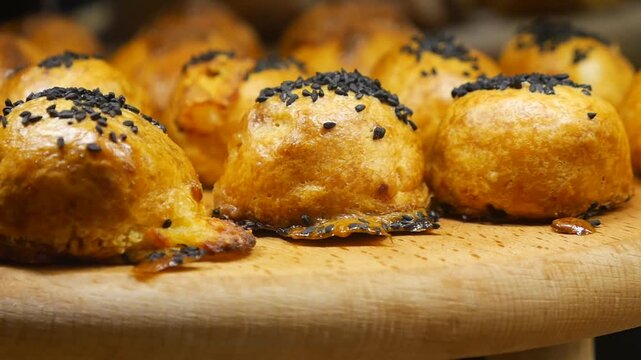 Cooking pastries on a wooden plate in a kitchen