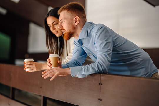 Business colleagues drinking coffee during office break