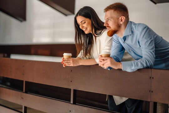 Business colleagues enjoying coffee break and conversation