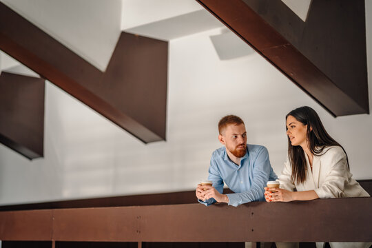Business colleagues conversing during coffee break in office